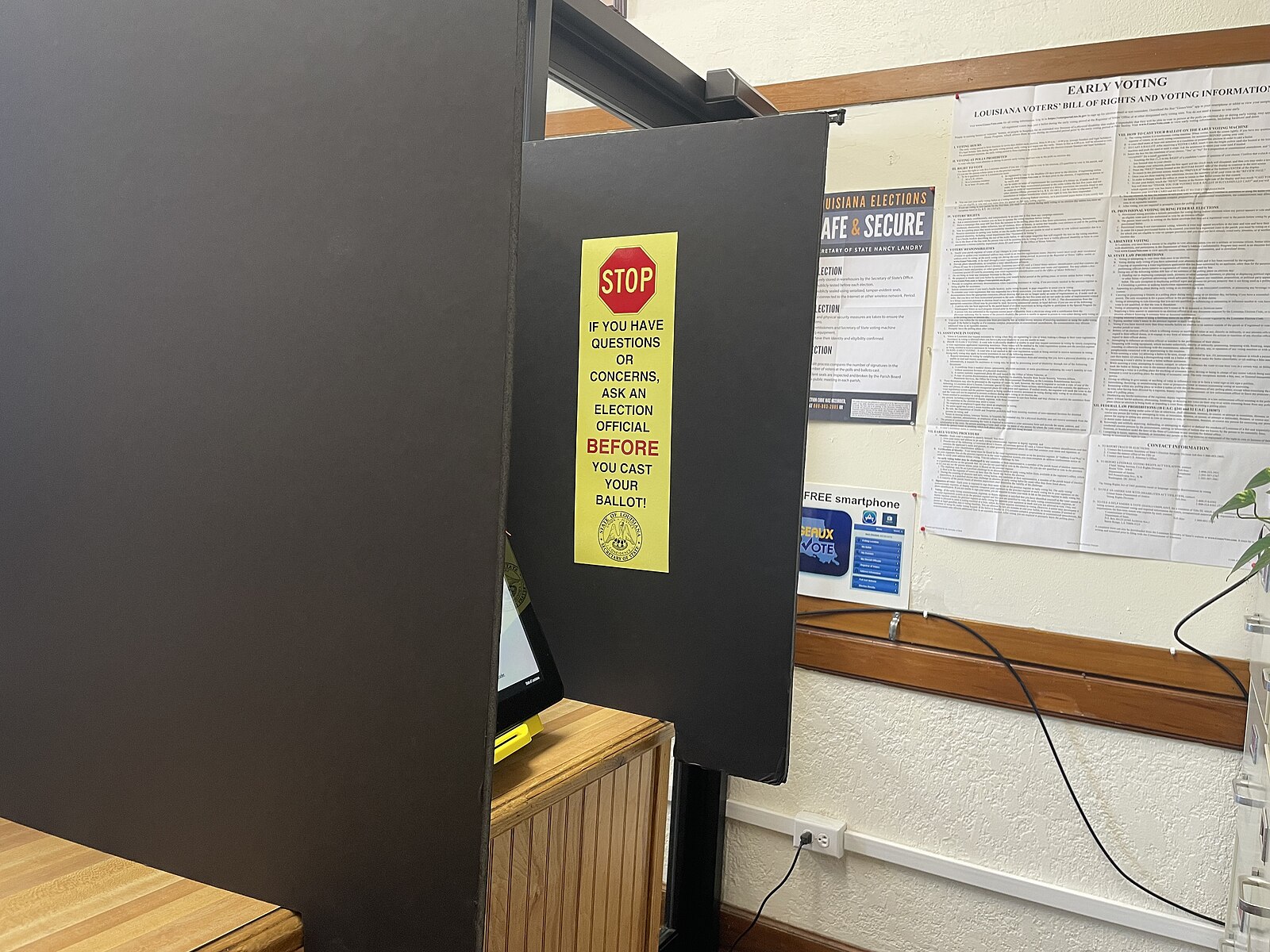 An early voting booth with election information posted at the Madison Parish Courthouse in Tallulah, Louisiana