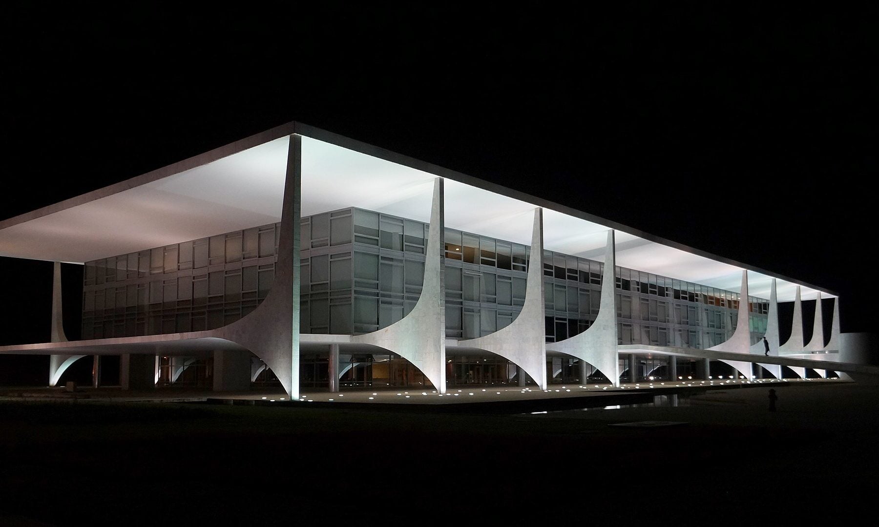 The Palácio do Planalto presidential office in Brasília lit up at night under a black sky