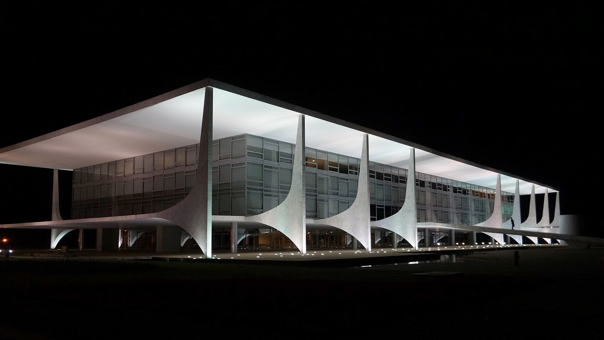 The Palácio do Planalto presidential office in Brasília lit up at night under a black sky