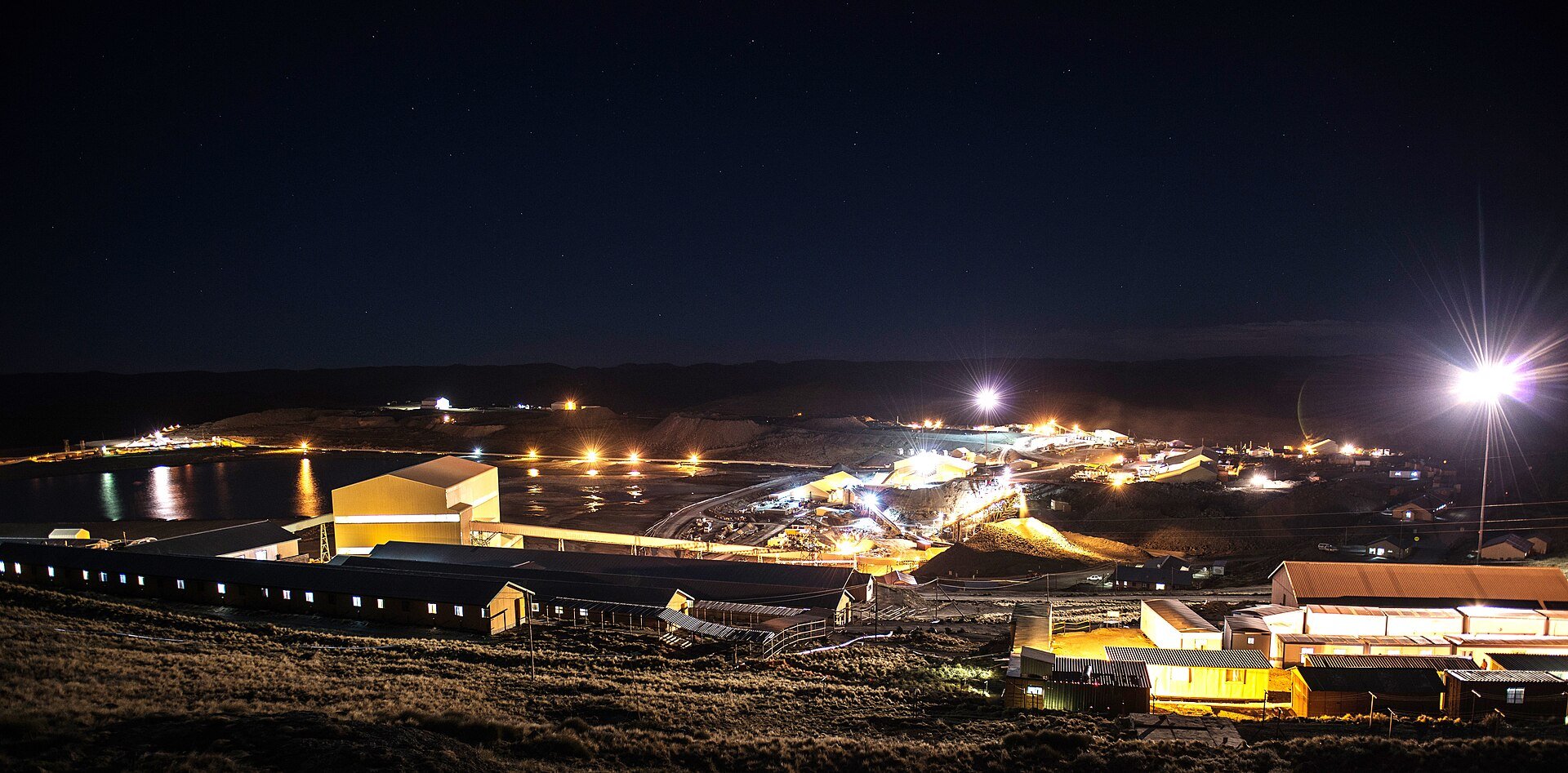 Night view of the Letšeng diamond mine processing plant and camp lit up in the highlands of Lesotho