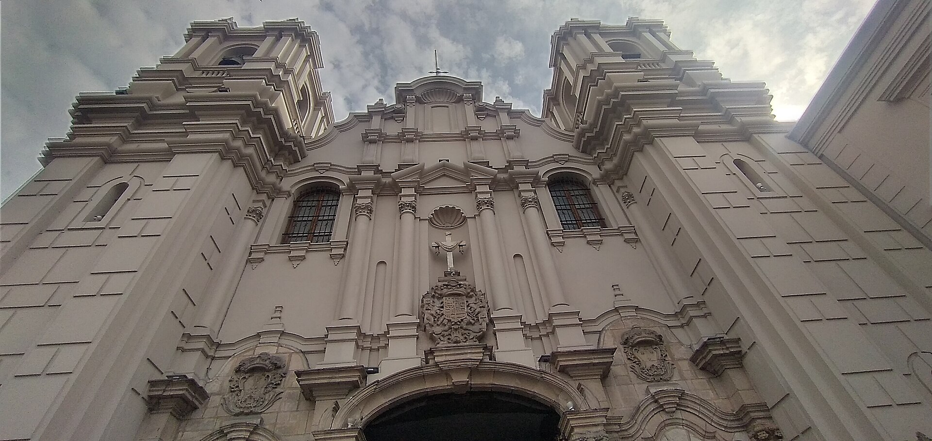 Baroque facade and twin towers of the Las Nazarenas church in central Lima, seen from below