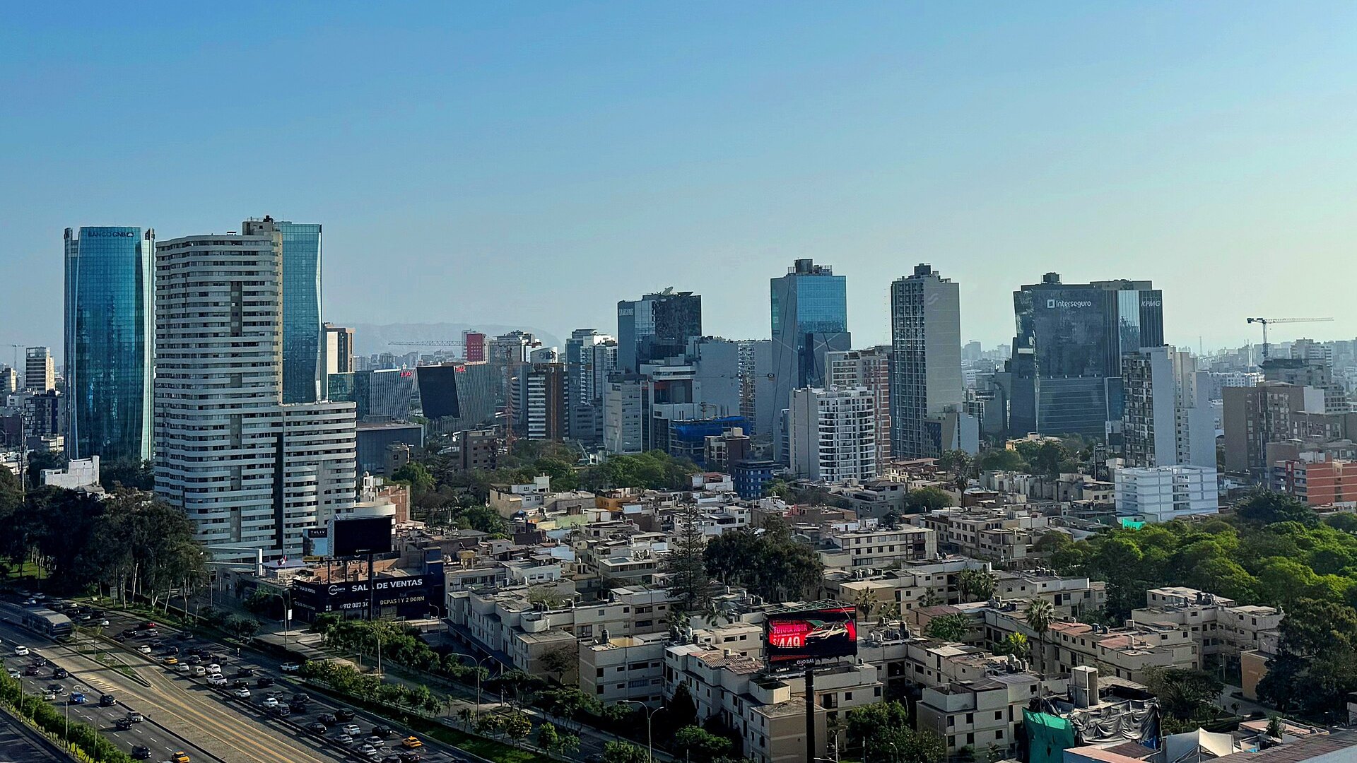 Office and apartment towers of the San Isidro district in Lima, Peru, beside an expressway