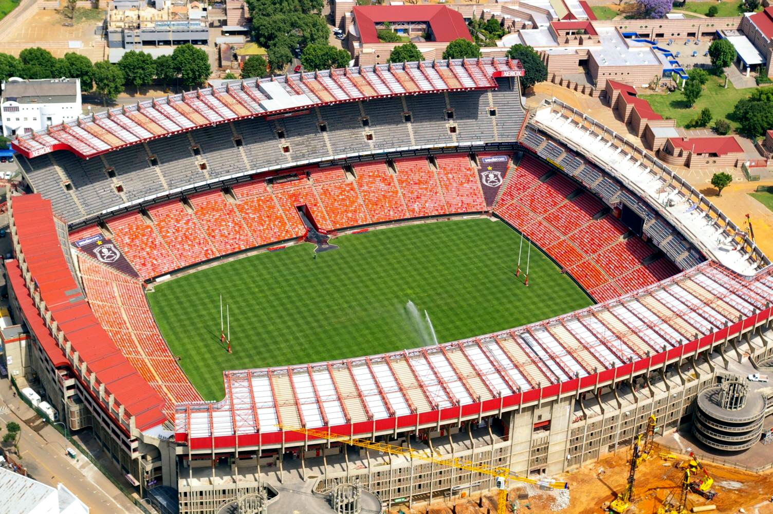 Aerial view of Ellis Park Stadium in Johannesburg, a rugby and football ground with red roofing and a green pitch