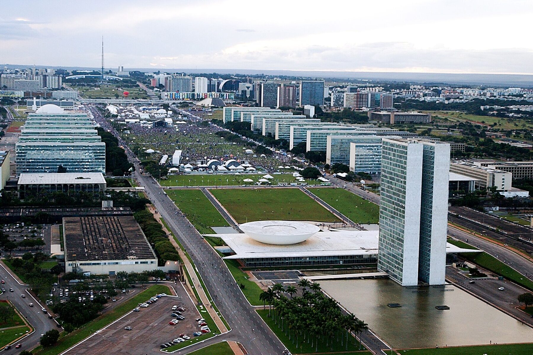Aerial view of Brasilia's Esplanada dos Ministerios with the twin towers and bowl-shaped domes of Congress and ministry buildings along the avenue