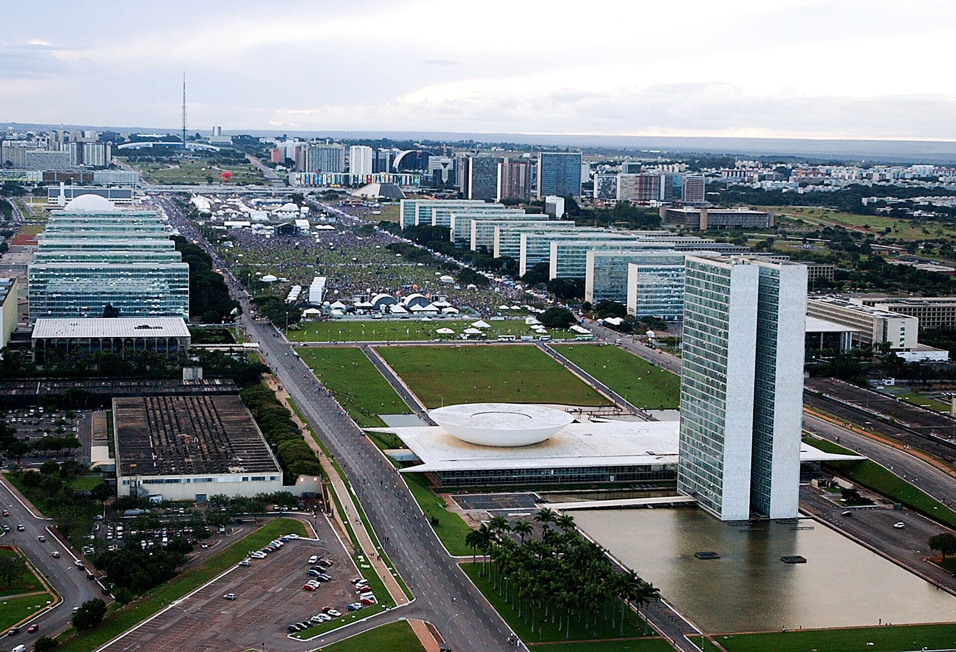Aerial view of Brasilia's Esplanada dos Ministerios with the twin towers and bowl-shaped domes of Congress and ministry buildings along the avenue
