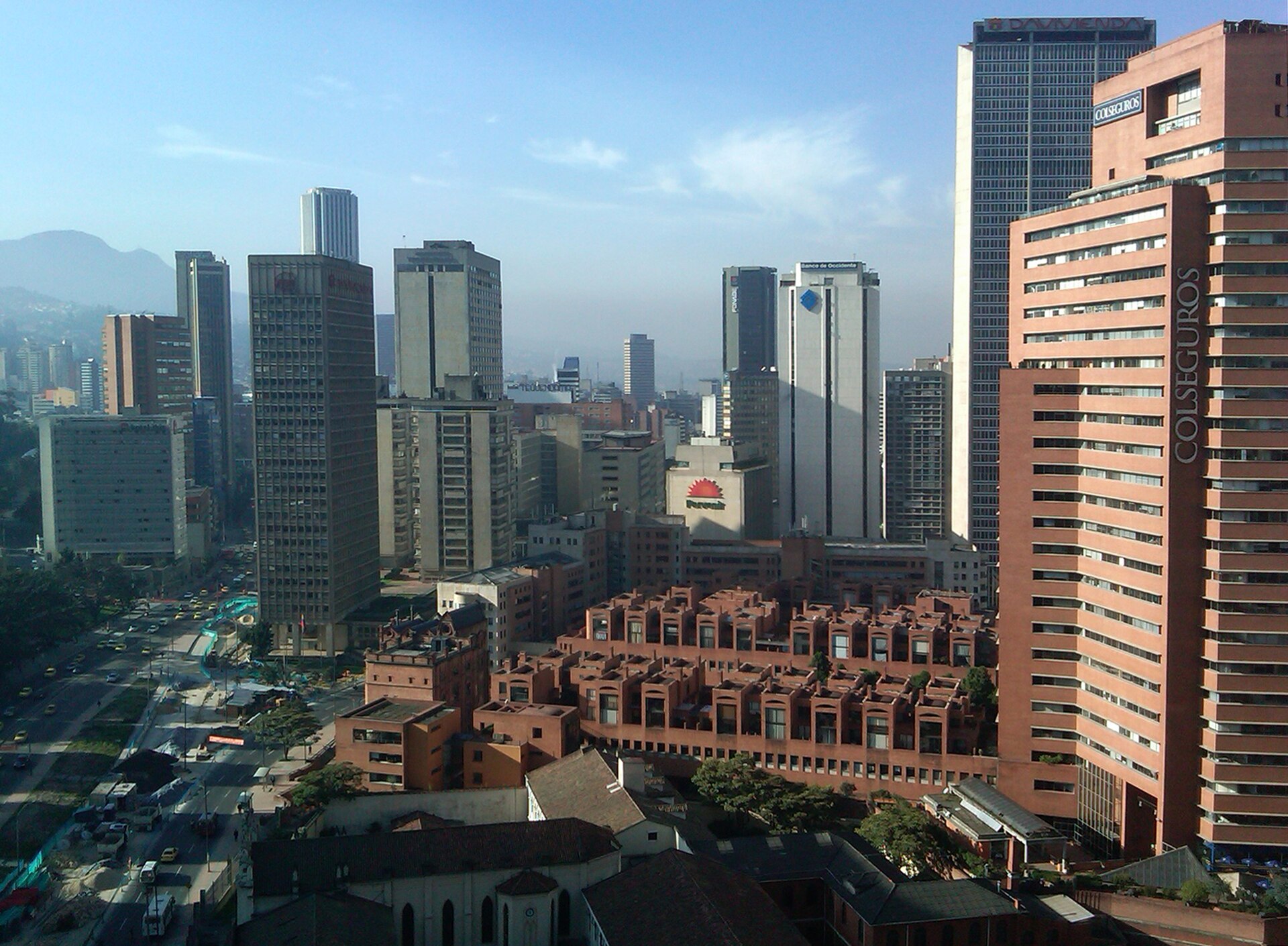 Office towers of Bogotá's Centro Internacional business district, including the Colseguros tower, with mountains in the background