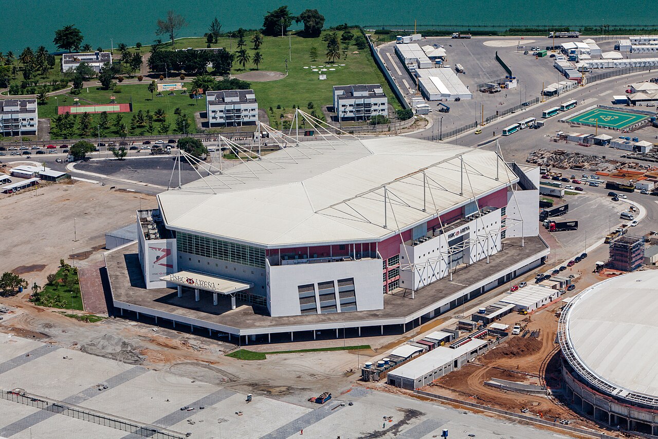 Aerial view of the Rio de Janeiro arena in Barra da Tijuca, now called Farmasi Arena, with its white roof and glass front.
