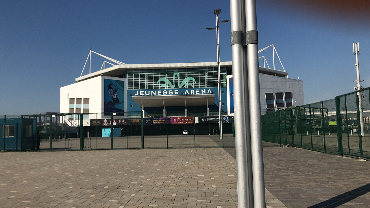 The entrance of the Rio de Janeiro arena in Barra da Tijuca under its former name, Jeunesse Arena, with a paved forecourt.
