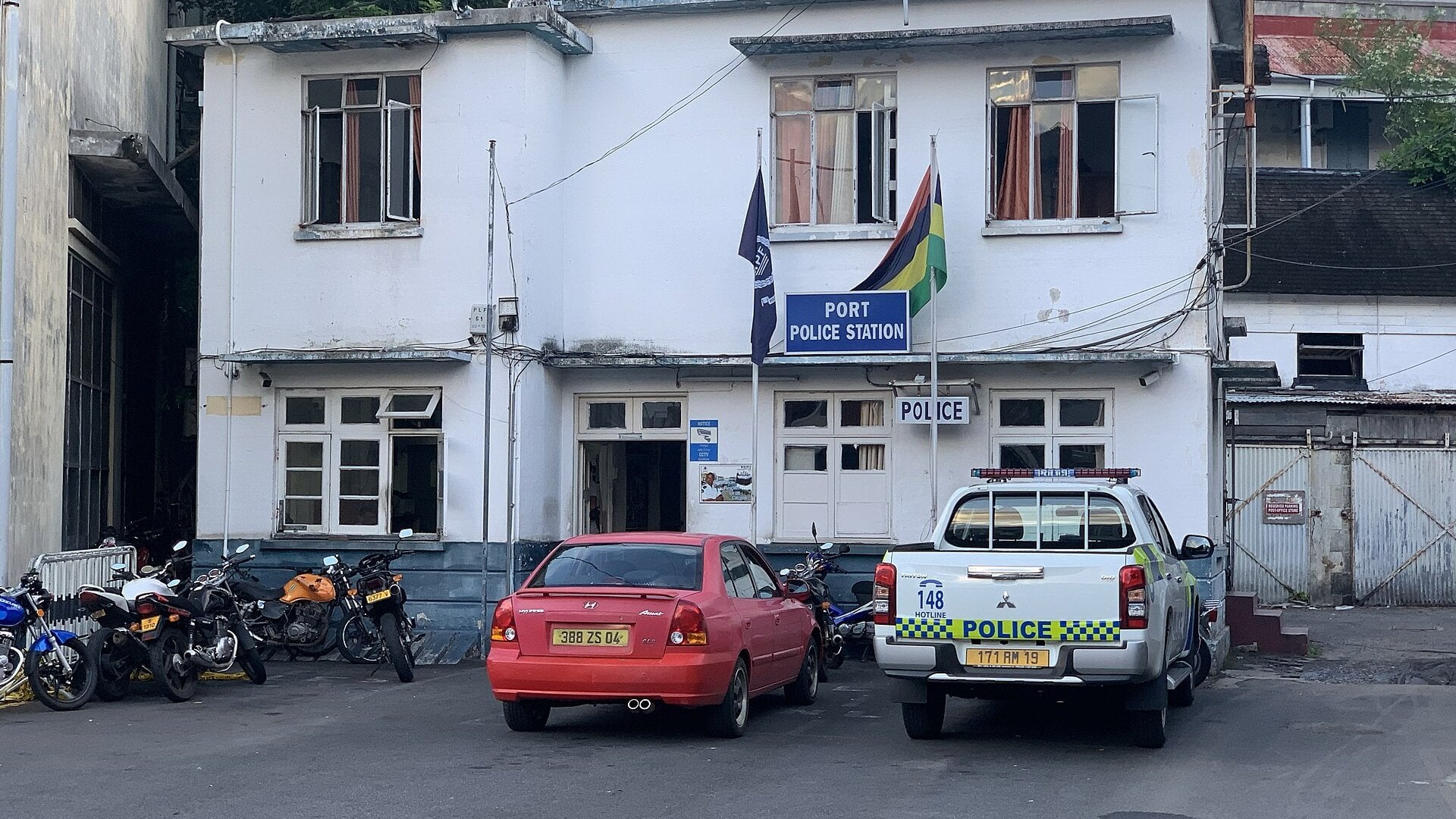 Port Police Station building at Port Louis harbour in Mauritius with a police pickup truck parked outside