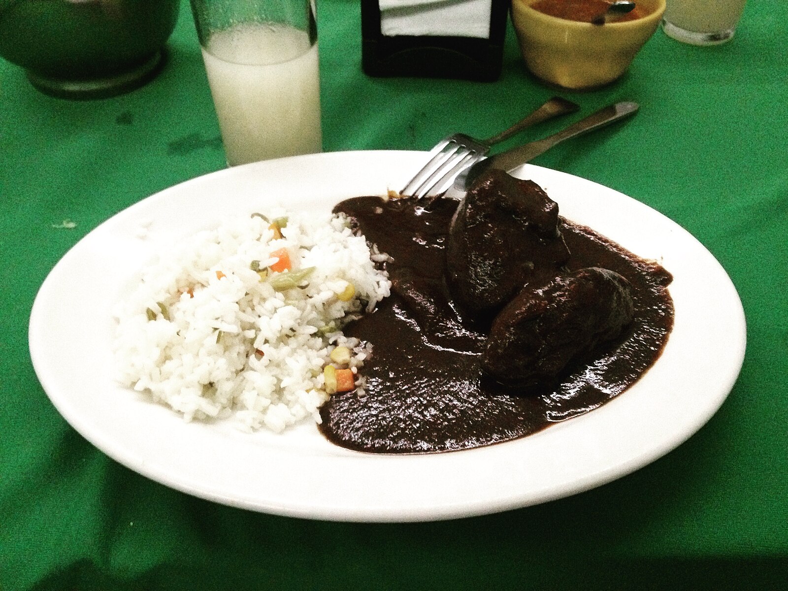 Mexico food in Oaxaca: mole negro with chicken and white rice
