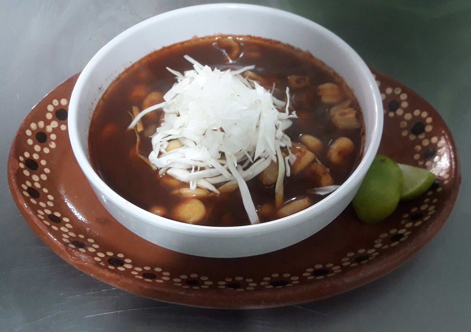Mexico food on the Pacific coast: red pozole with cabbage and lime in Mazatlán