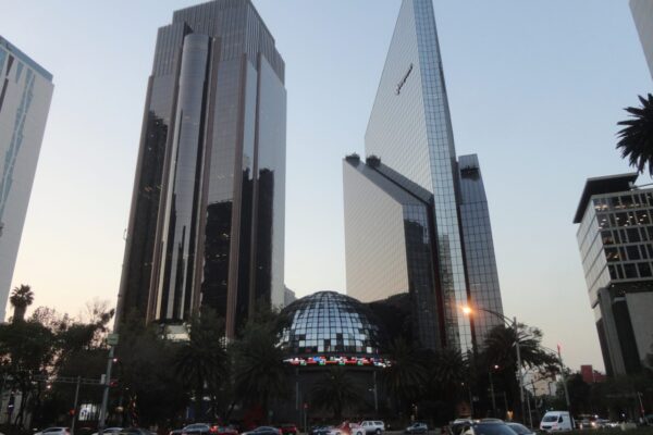 The glass dome of the Bolsa Mexicana de Valores between two office towers on Paseo de la Reforma in Mexico City