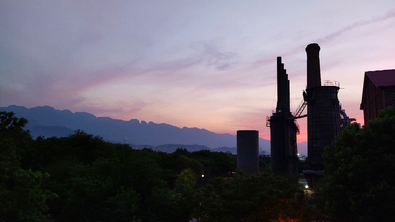 Sierra Madre Oriental ridge at dusk beside the old blast furnaces of Fundidora Park in Monterrey, Mexico