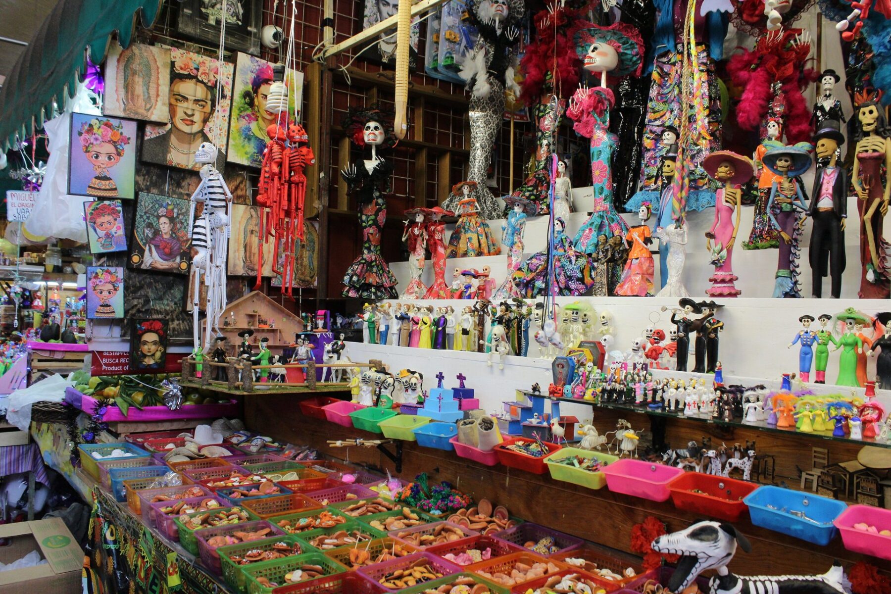 Market stall in Mexico City selling Day of the Dead figures, sweets and decorations