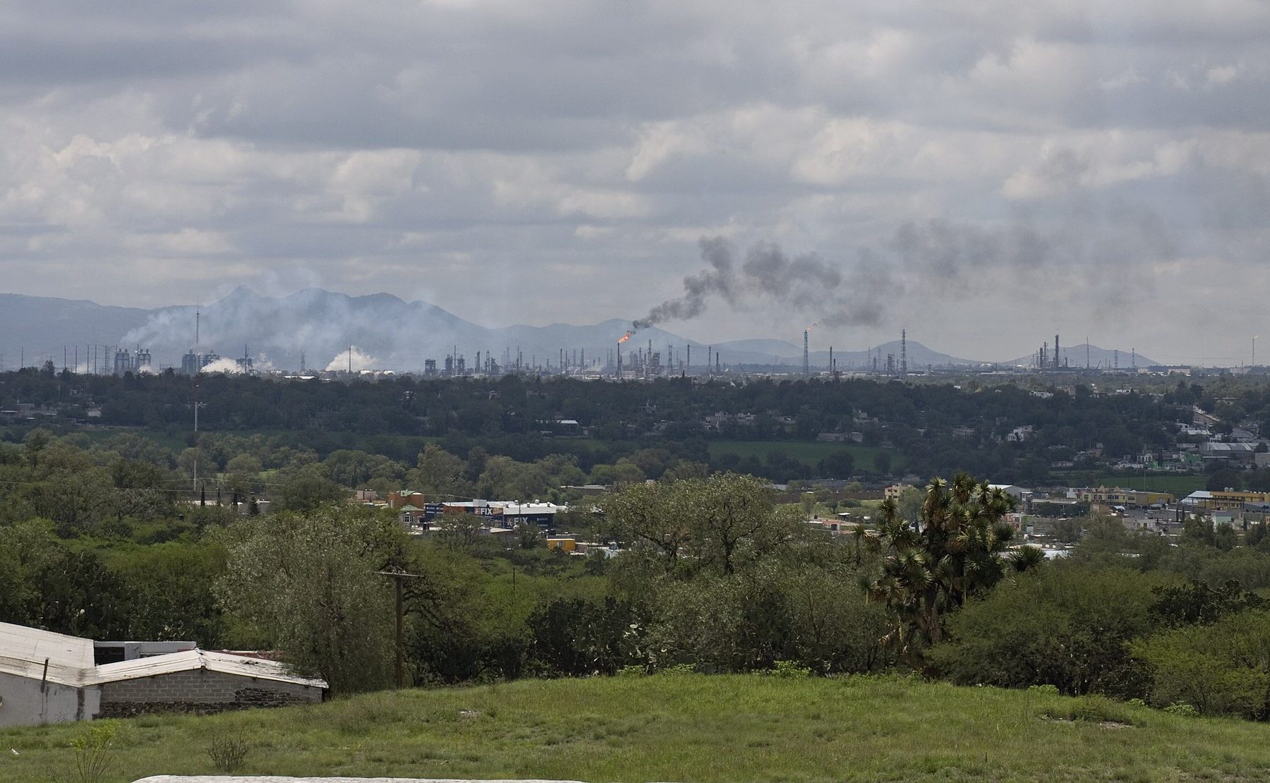 Flare and smoke rising from the Pemex refinery complex at Tula, Hidalgo, Mexico