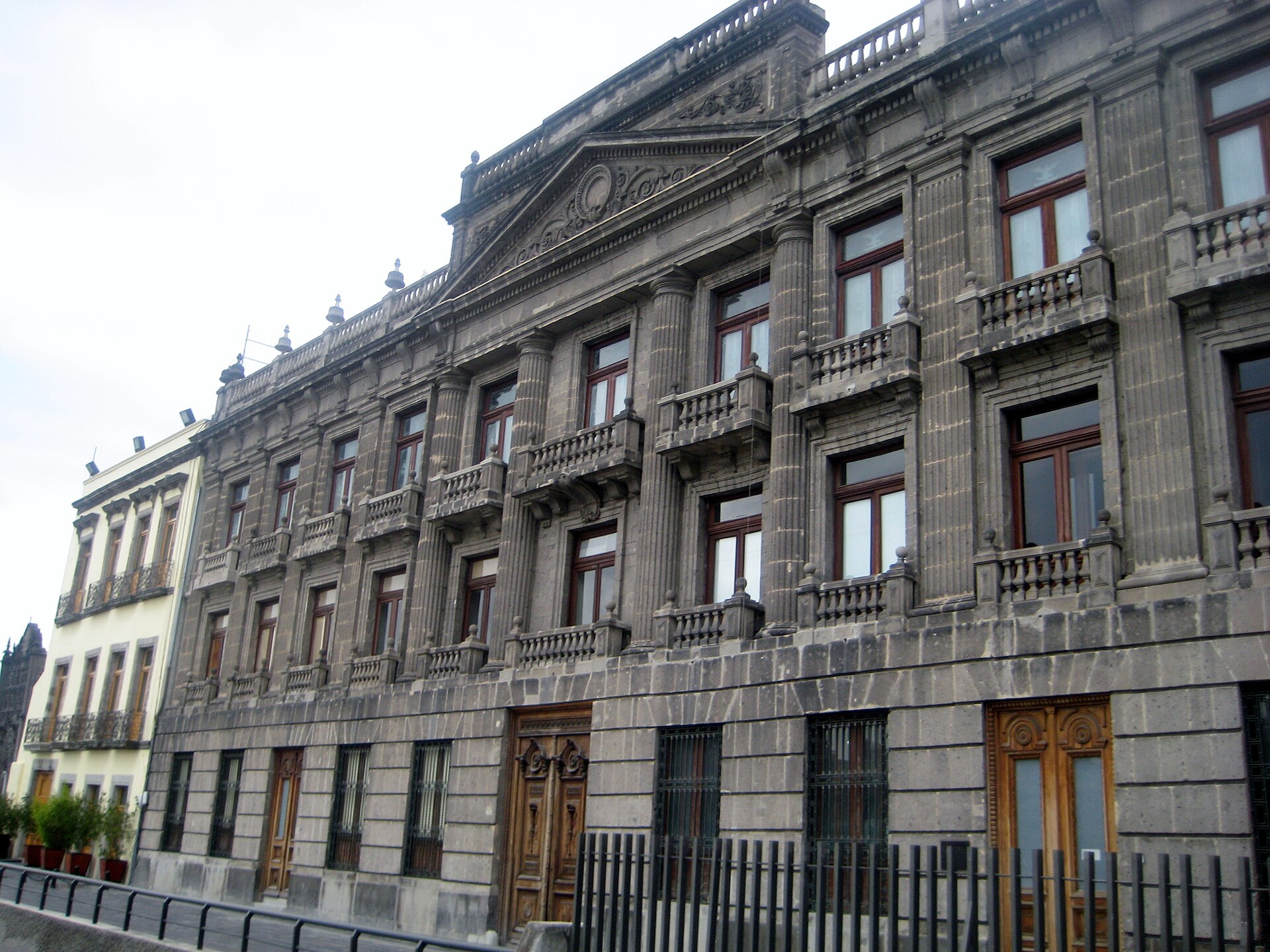 The grey stone facade of the former Royal Mint building in central Mexico City