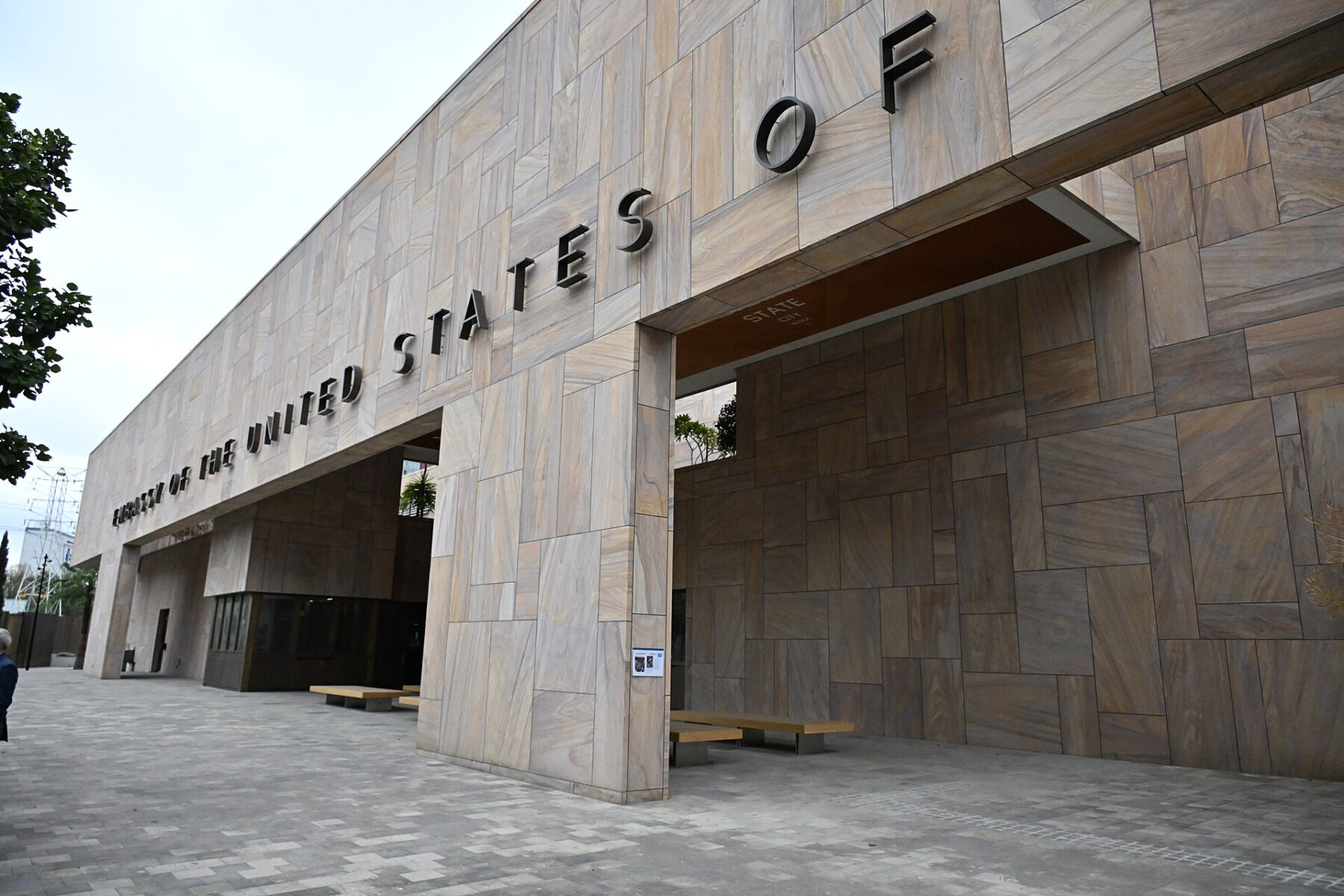 Front of the US Embassy building in Mexico City with raised lettering reading Embassy of the United States