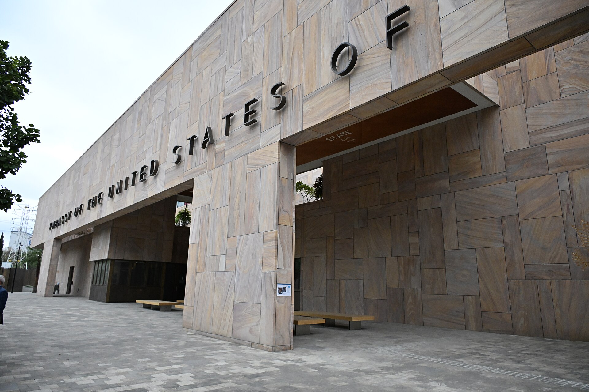 Front of the US Embassy building in Mexico City with raised lettering reading Embassy of the United States