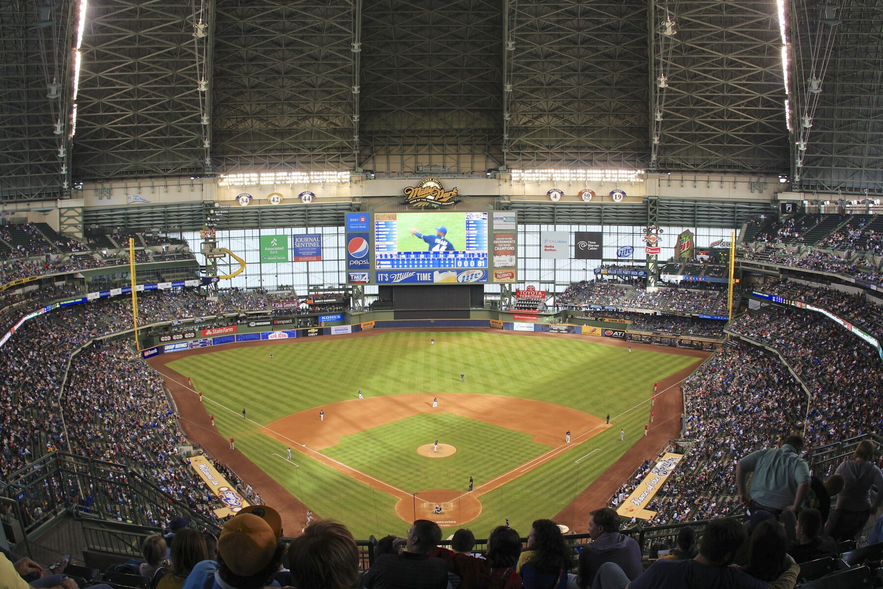 Packed Miller Park in Milwaukee, now American Family Field, with the field and scoreboard during a Brewers game