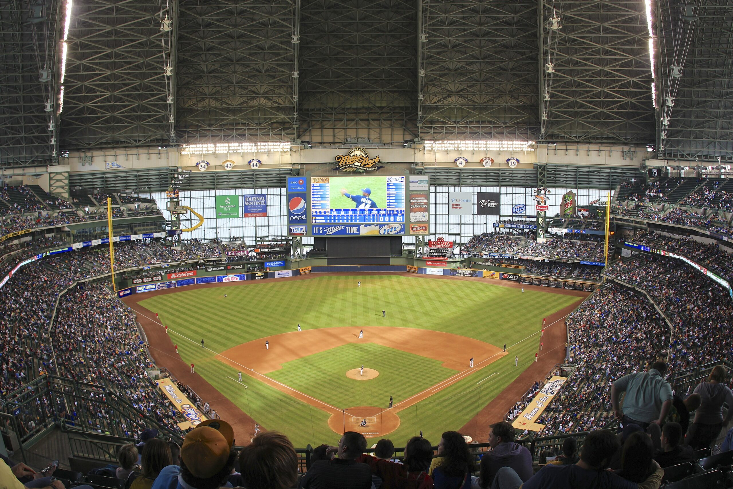 Packed Miller Park in Milwaukee, now American Family Field, with the field and scoreboard during a Brewers game