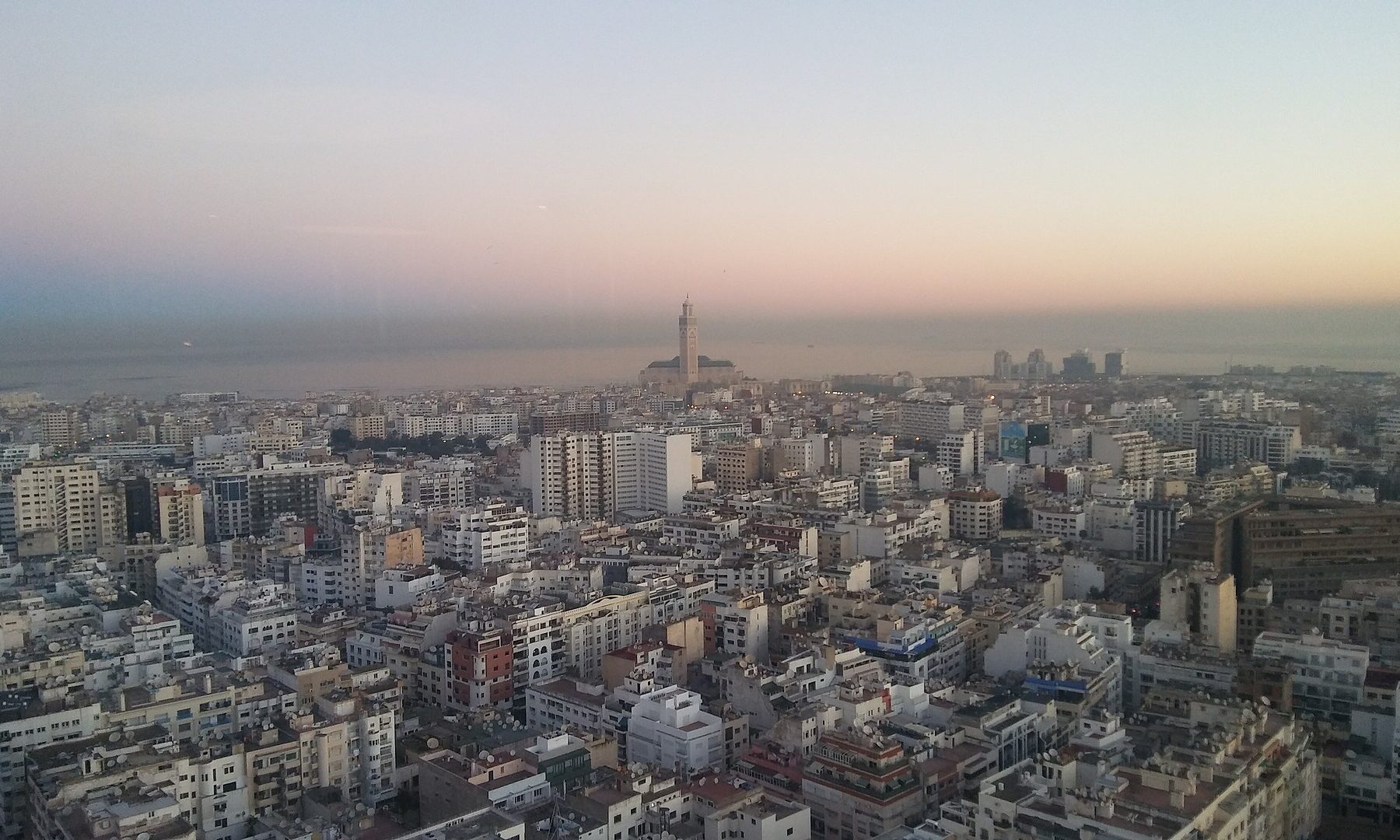 Casablanca skyline with the Hassan II Mosque minaret at sunrise, Morocco