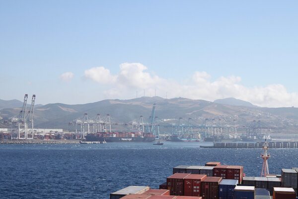 Morocco growth: container cranes and a Hapag-Lloyd cargo ship at the Tanger Med port on the Strait of Gibraltar, Morocco
