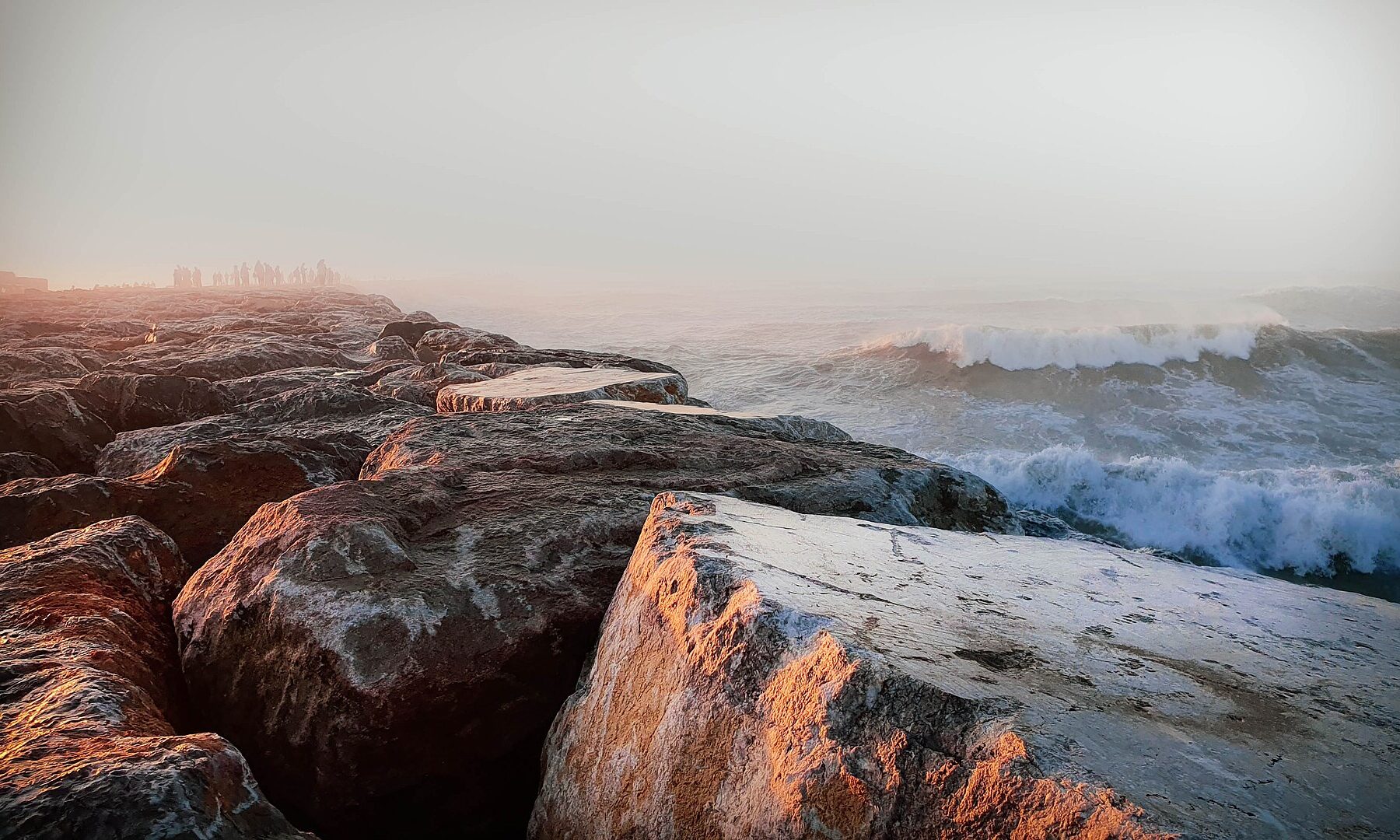 Waves breaking against the Mehdia breakwater at the mouth of the Sebou River near Kenitra, Morocco