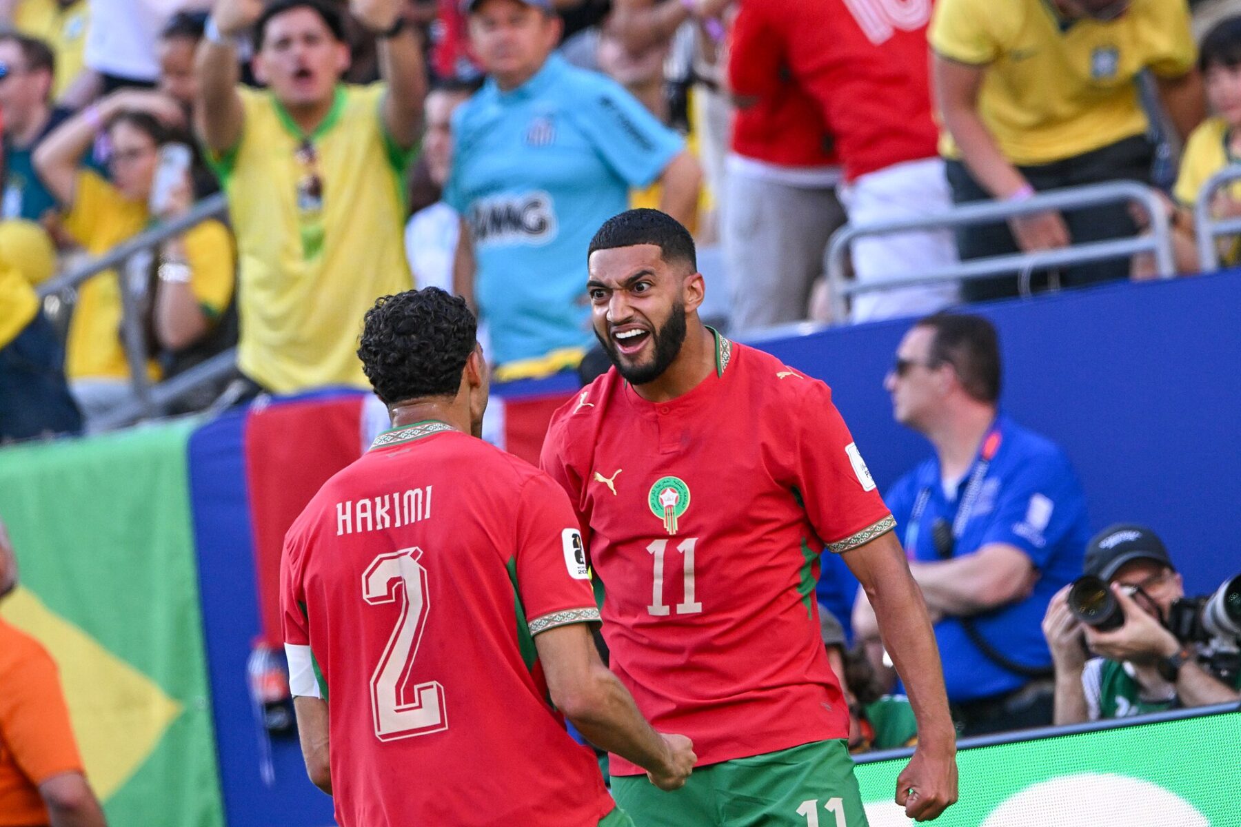 Ismael Saibari celebrates with Achraf Hakimi after scoring for the Morocco national football team against Brazil at the 2026 World Cup
