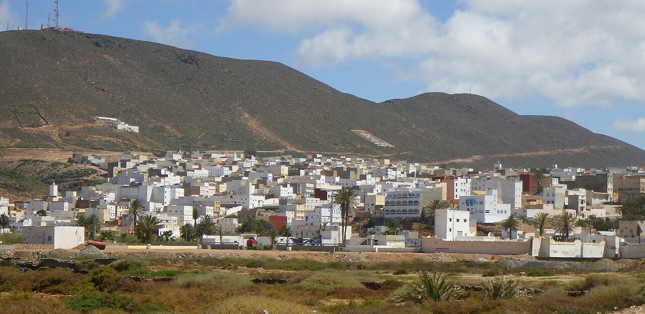 White houses of the Atlantic town of Sidi Ifni in southern Morocco below dry brown hills