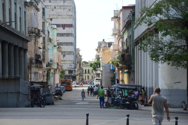 Moving to Cuba: a street near Old Havana with bicycle taxis and apartment buildings