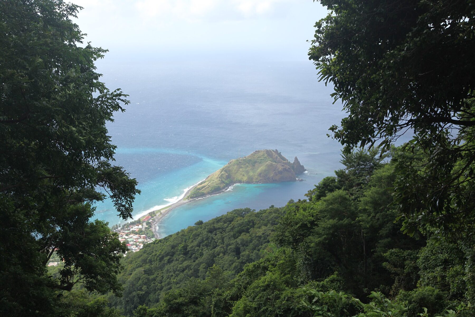 Moving to Dominica: the Scotts Head peninsula and village on Dominica's southern tip, seen through rainforest from the Waitukubuli National Trail