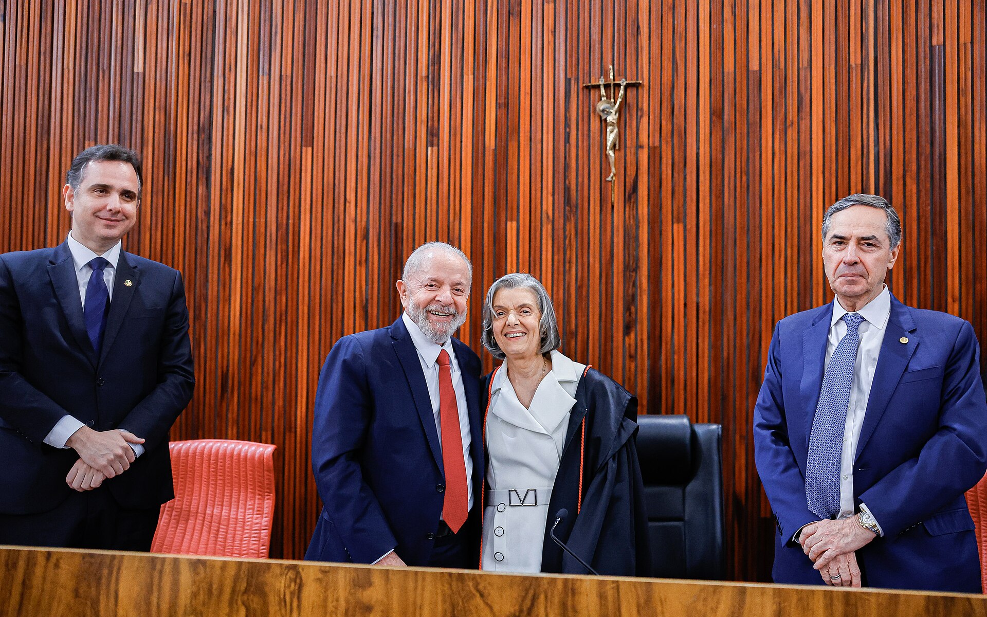 Four people standing at the wood-panelled bench of Brazil's Superior Electoral Court plenary in Brasília