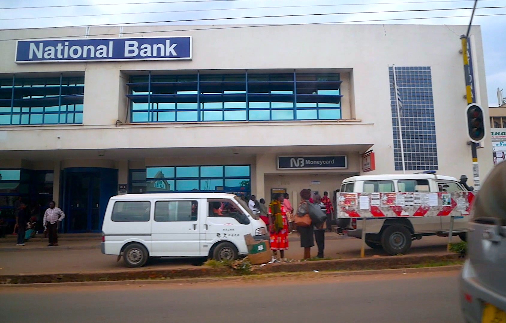 National Bank of Malawi branch in Lilongwe with people outside on the pavement