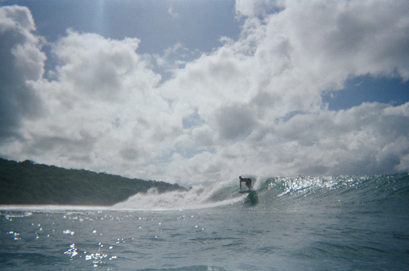 A surfer rides a wave at Popoyo on the Pacific coast of Nicaragua