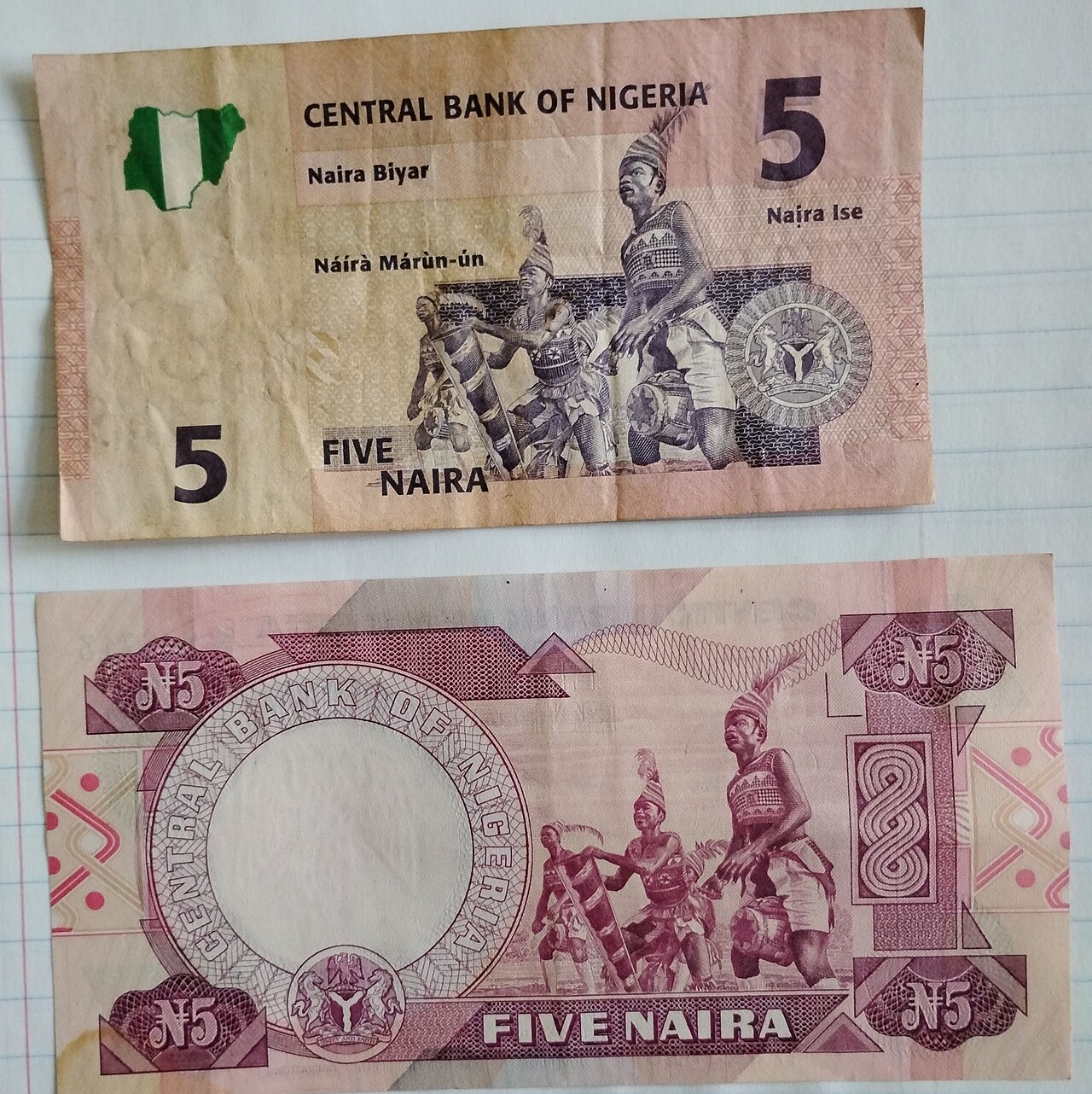 Two Nigerian five-naira notes, front and back, issued by the Central Bank of Nigeria