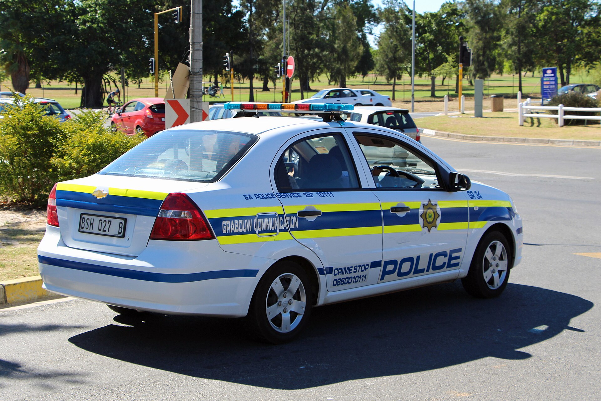 A white South African Police Service patrol car from Grabouw on a road in the Western Cape