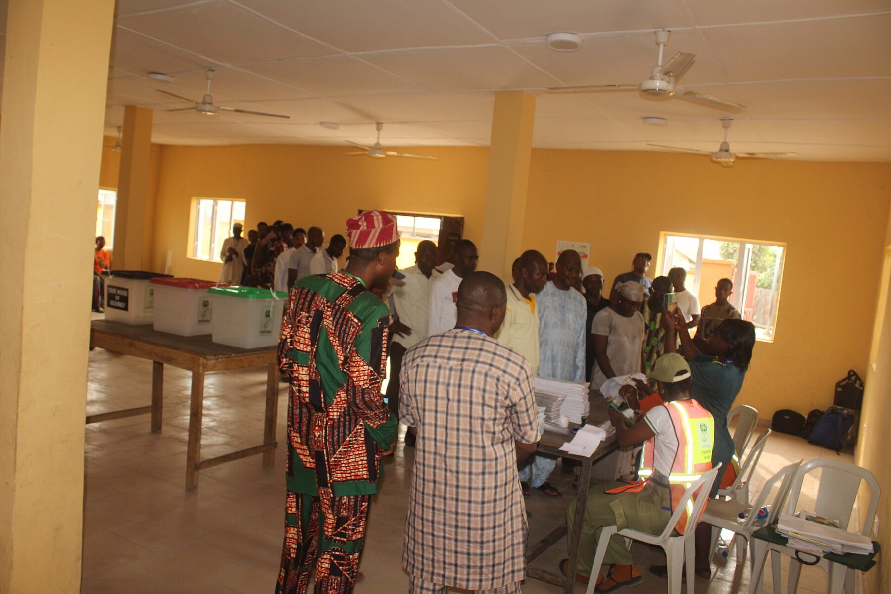 Voters and electoral officials at a polling station in Badagry, Nigeria