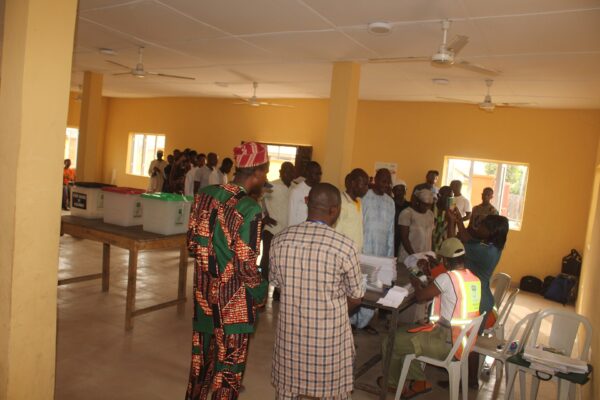 Voters and electoral officials at a polling station in Badagry, Nigeria