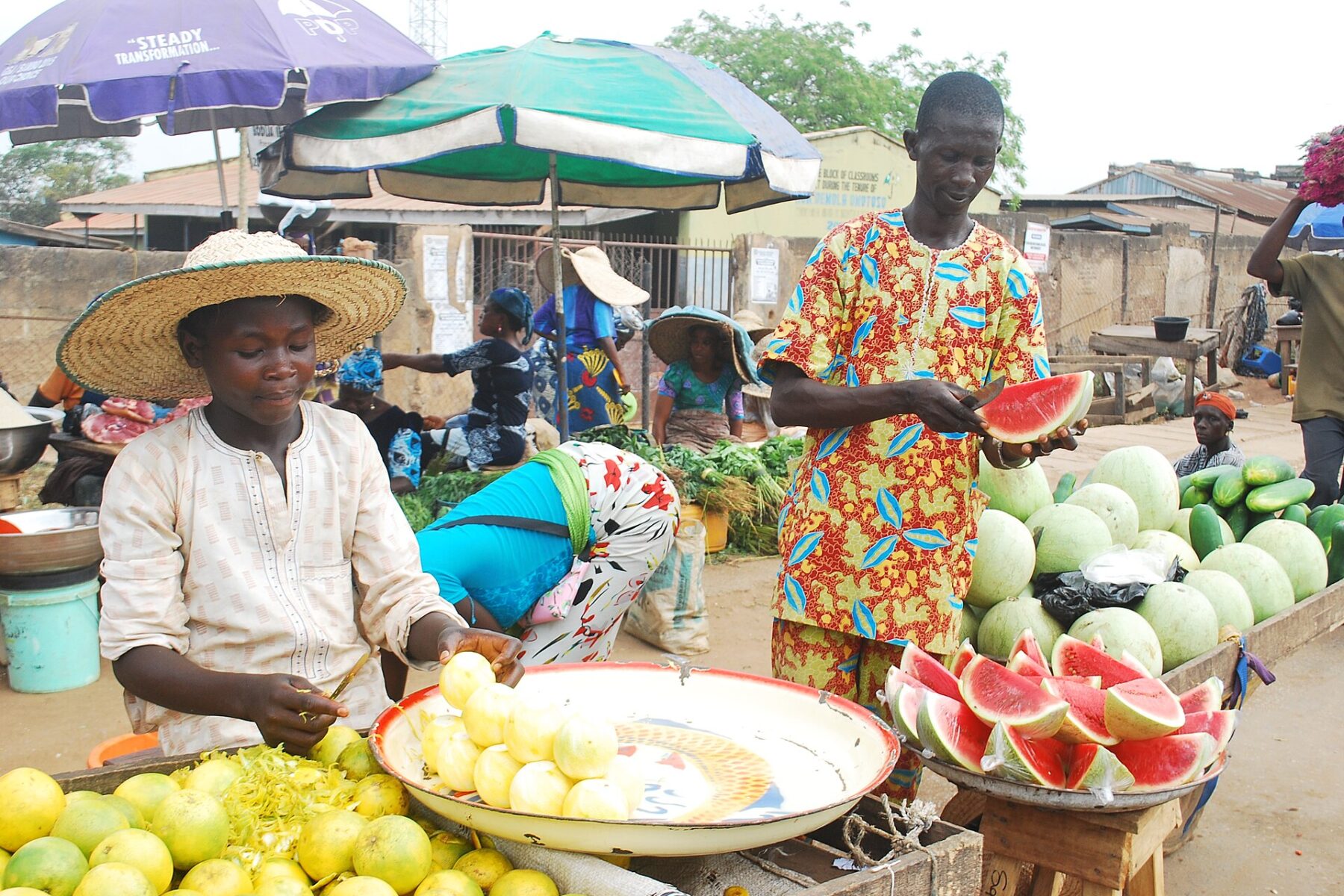 Fruit sellers with watermelons and oranges at Bodija market in Ibadan, Nigeria