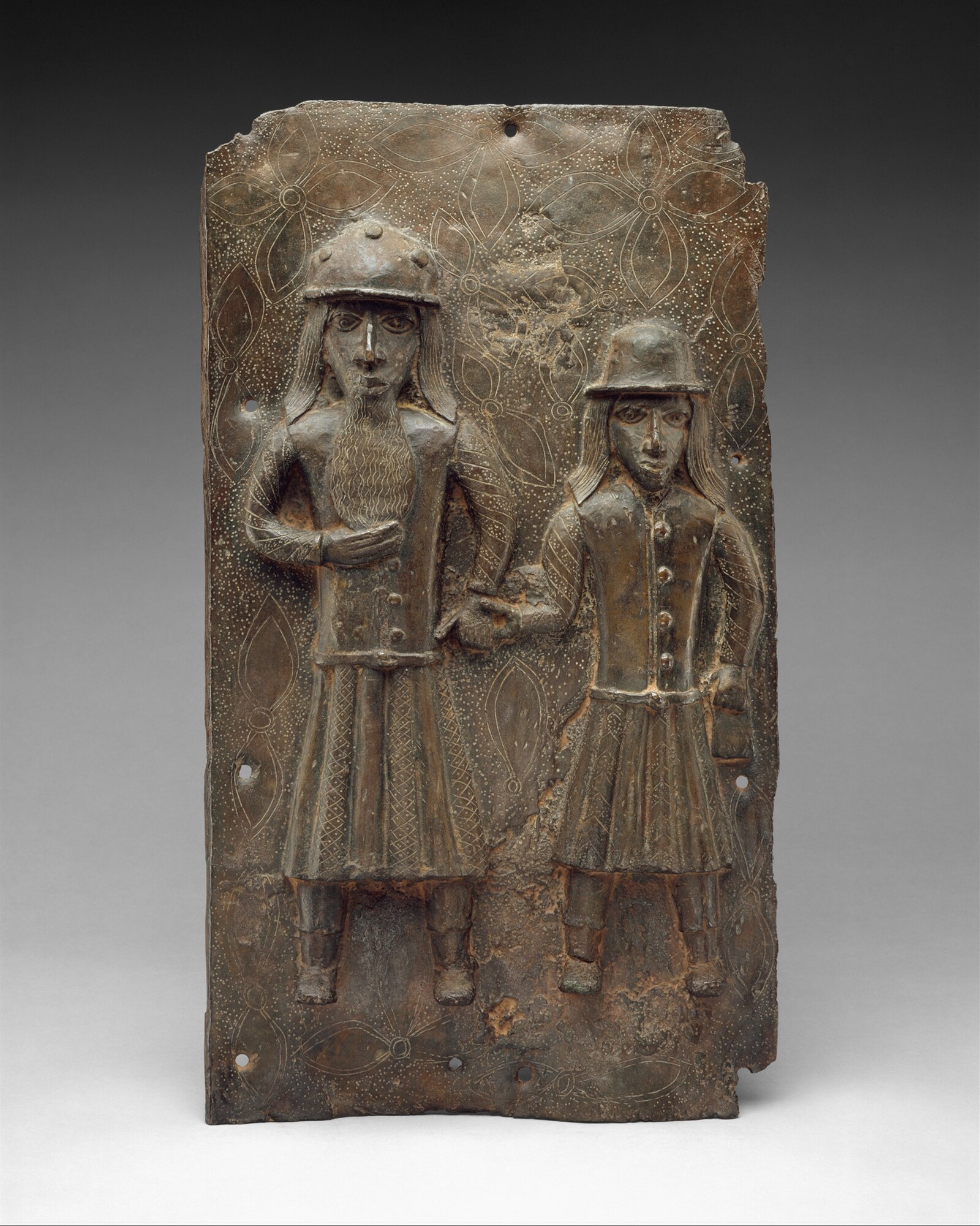 Nigeria history: a Benin brass plaque showing two Portuguese merchants