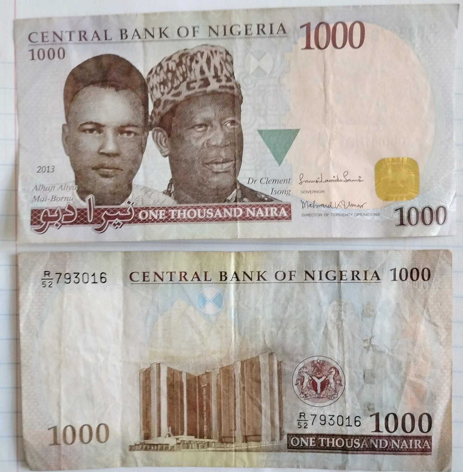 A Nigerian 1,000 naira note, front and back; the back shows the Central Bank of Nigeria headquarters building