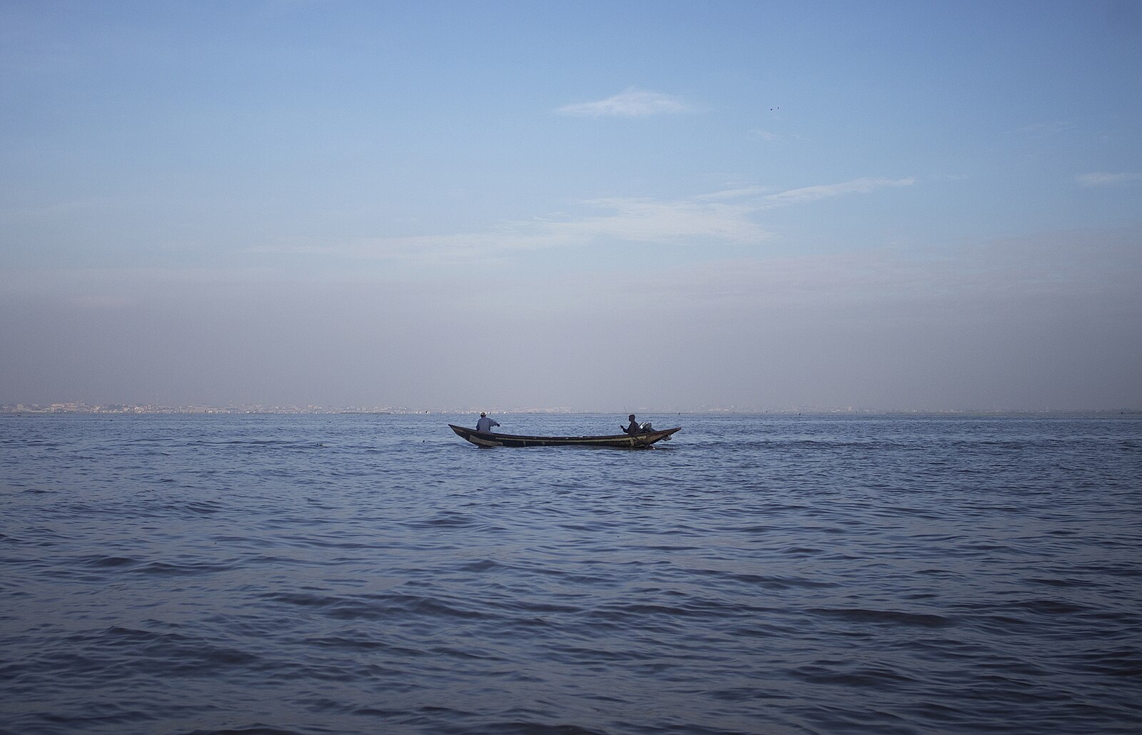 Fishermen in a canoe on the lagoon in Lagos, where water and fisheries are Nigeria resources too