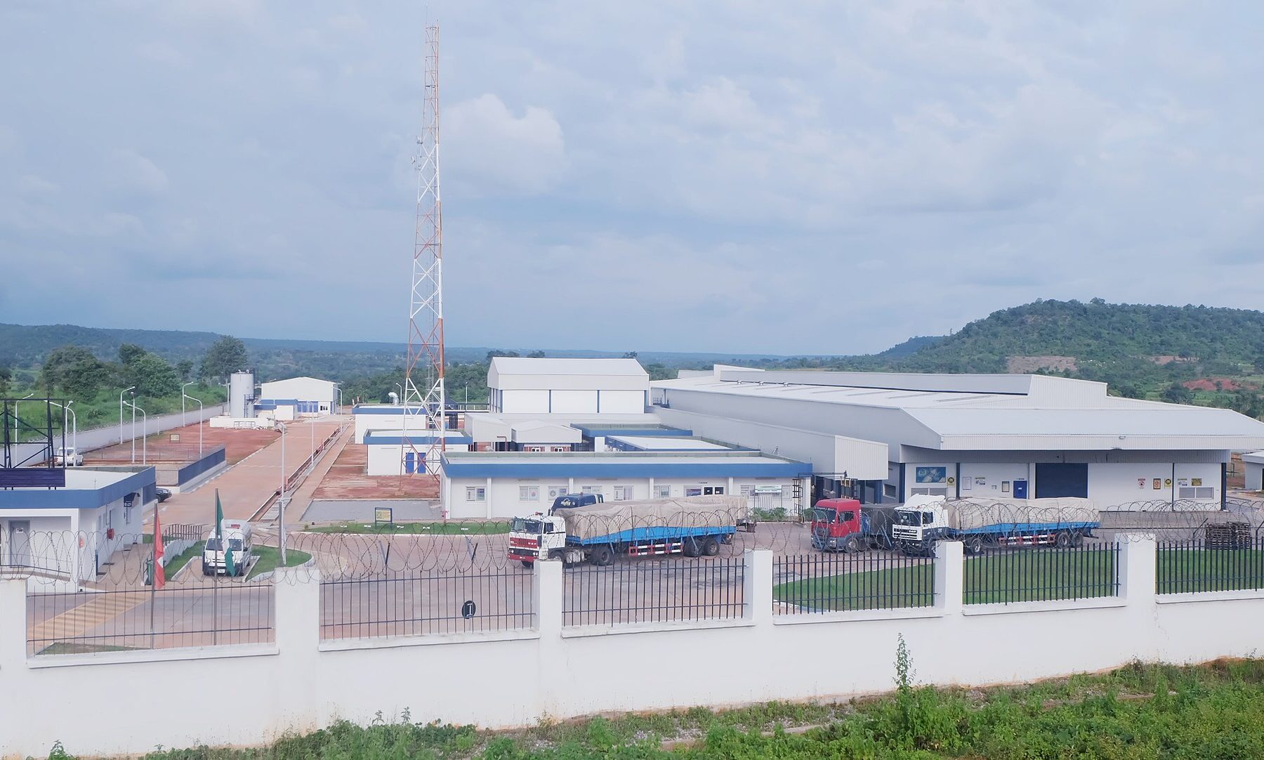 Nestlé water bottling plant in Abaji, Federal Capital Territory, Nigeria, with lorries parked inside the fence