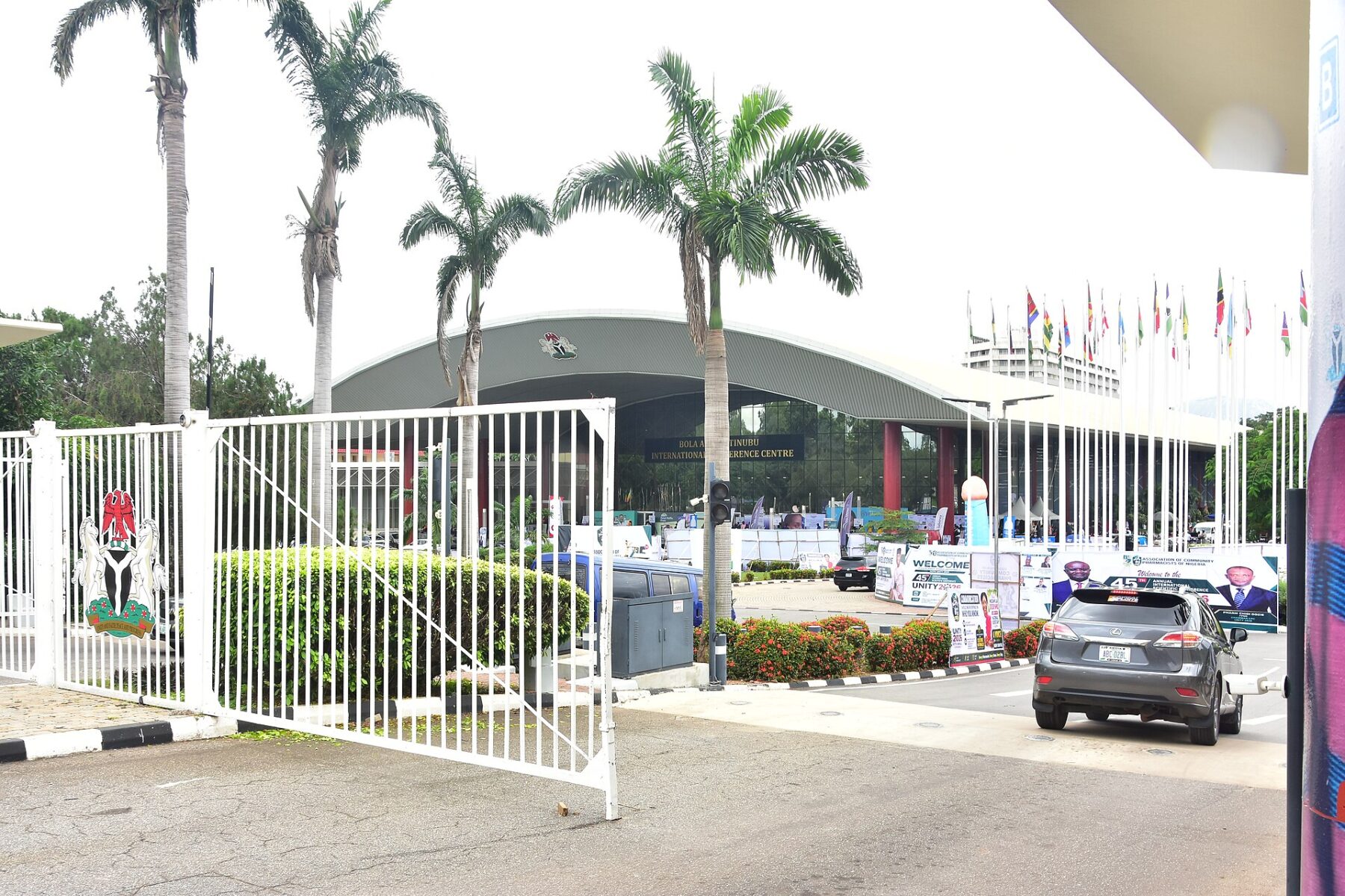 Entrance gate with the Nigerian coat of arms in front of the Bola Ahmed Tinubu International Conference Centre in Abuja