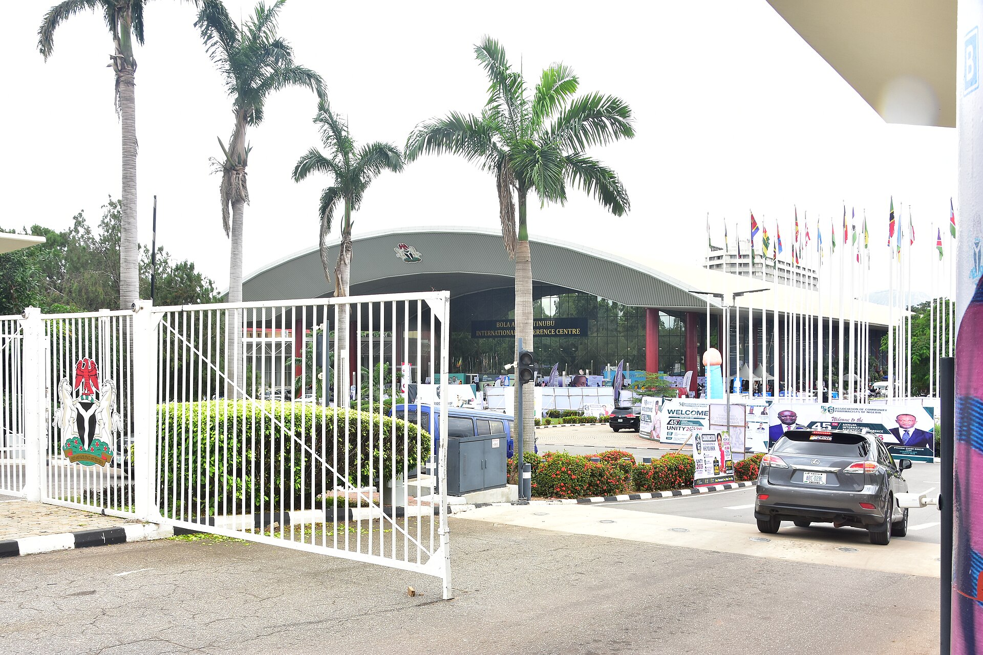 Entrance gate with the Nigerian coat of arms in front of the Bola Ahmed Tinubu International Conference Centre in Abuja