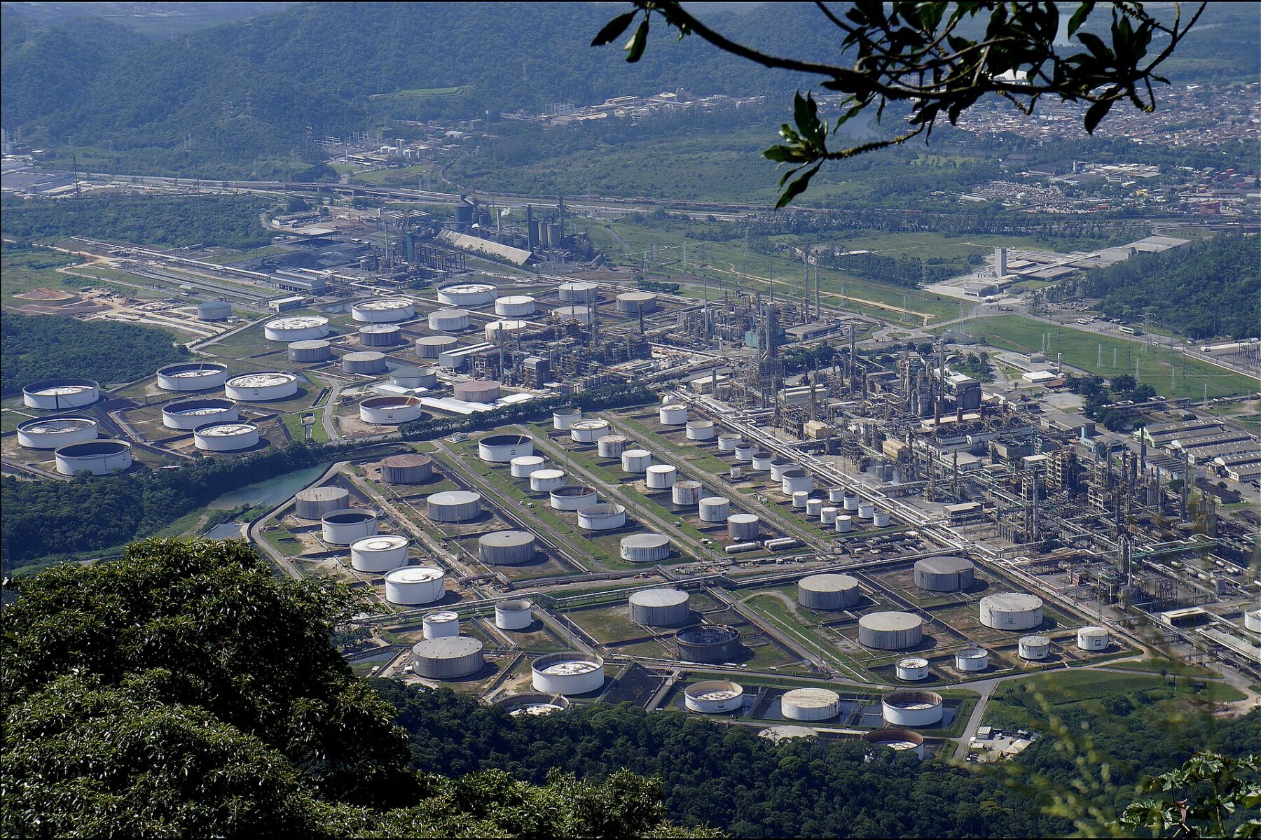 Storage tanks and process units of Petrobras's Presidente Bernardes refinery in Cubatão, São Paulo state, seen from the hills of the Serra do Mar.
