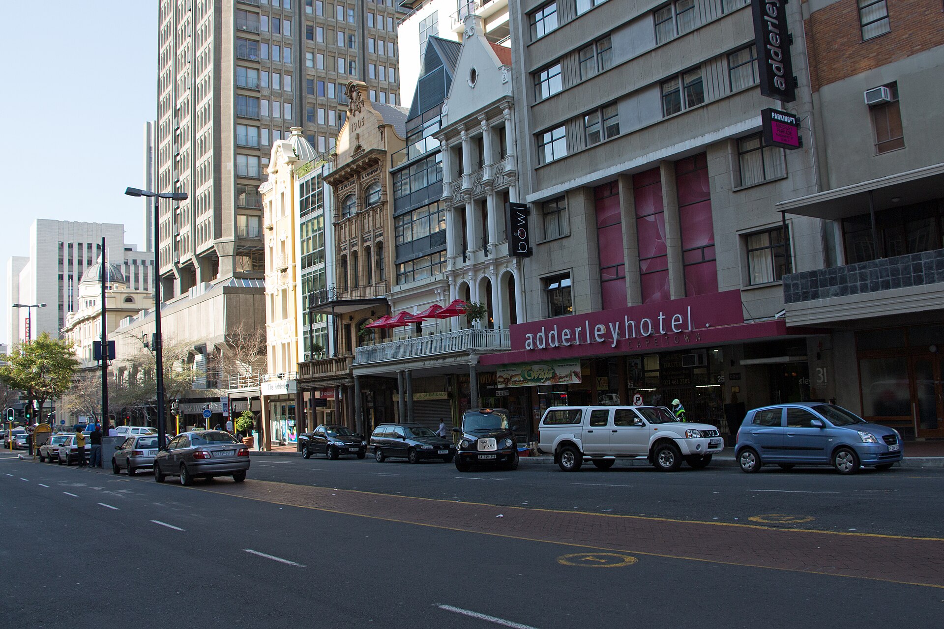 Adderley Street in central Cape Town with parked cars, office towers and the Adderley Hotel