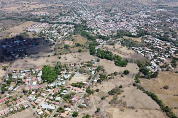 Aerial view of Las Tablas, capital of Los Santos province in Panama, with low houses and dry hills