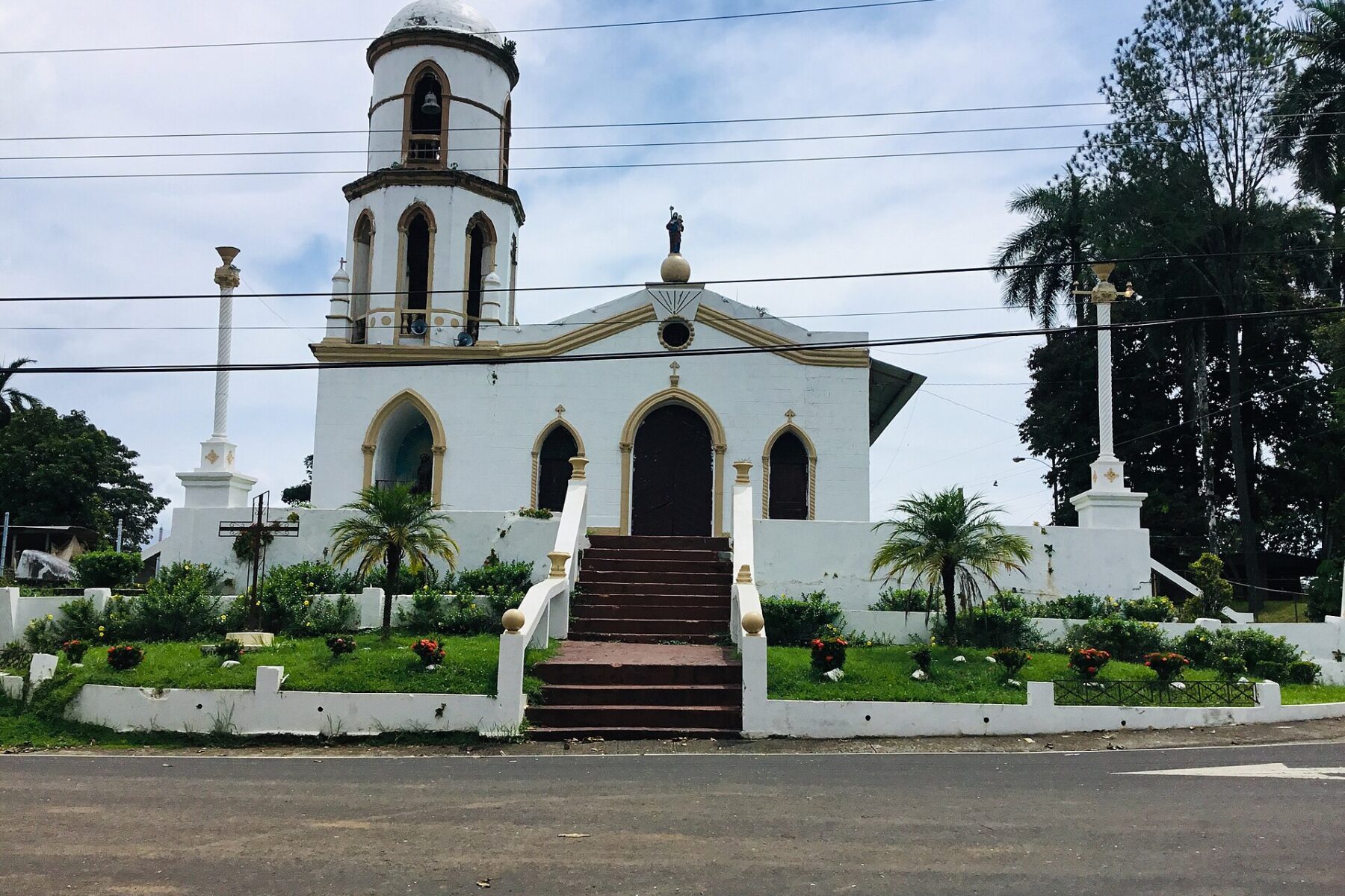A white church with a bell tower and red-brick steps in Soná, a district of Veraguas province, Panama