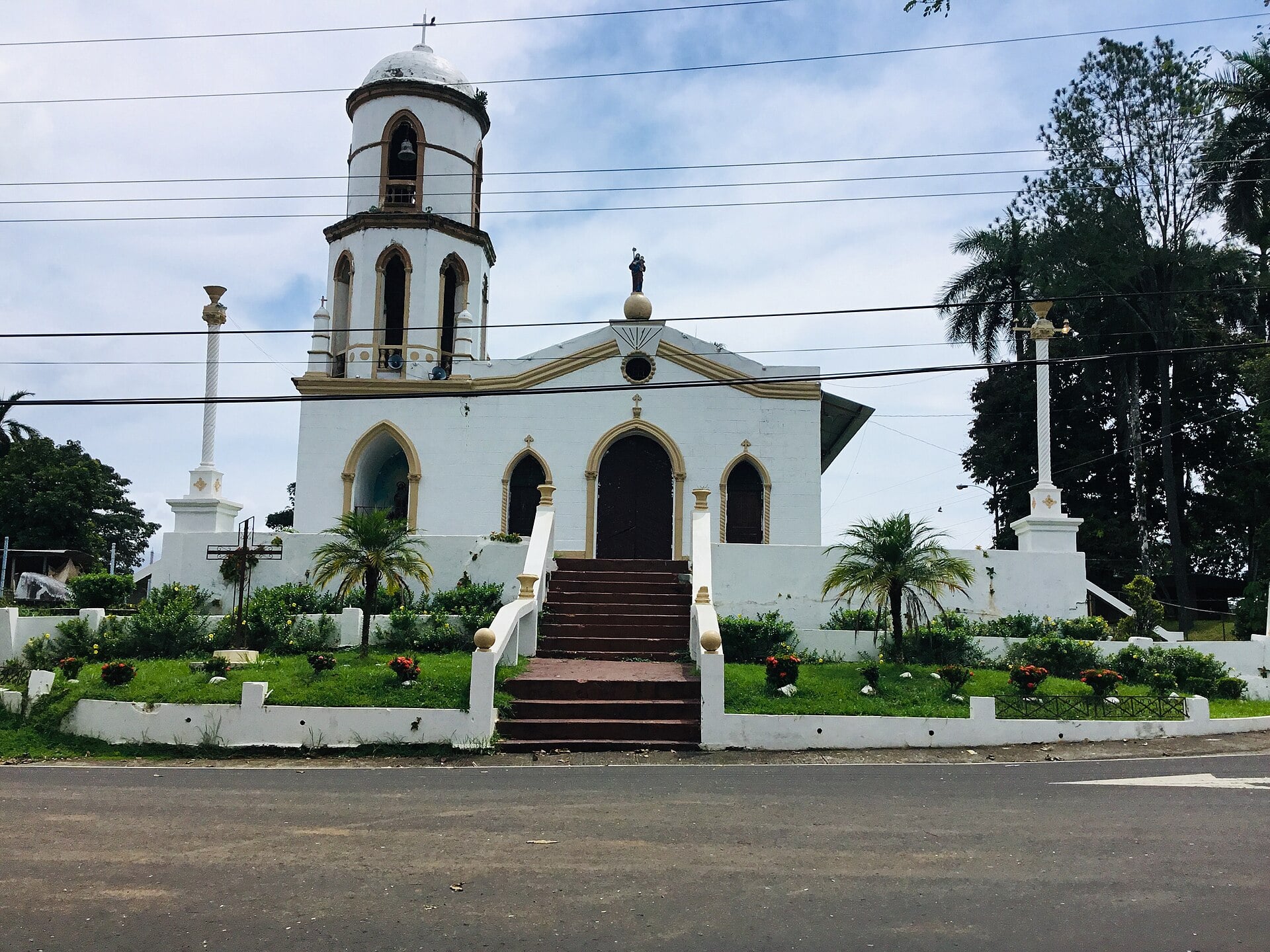 A white church with a bell tower and red-brick steps in Soná, a district of Veraguas province, Panama